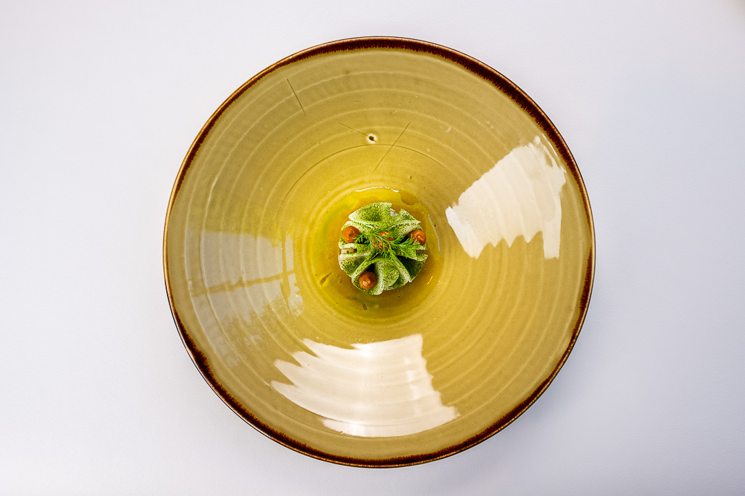 https://hungryformore.be/app/uploads/2024/12/de-jonkman-bruges-dish-on-a-yellow-plate.jpg