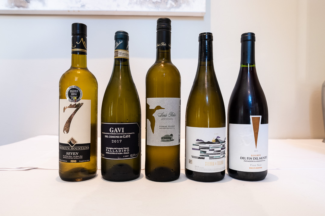 https://hungryformore.be/app/uploads/2024/12/de-jonkman-bruges-wine-bottles.jpg