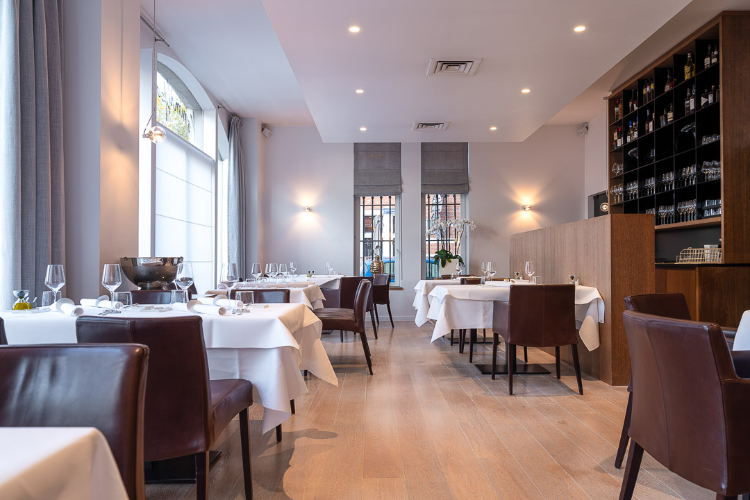 https://hungryformore.be/app/uploads/2024/12/kommilfoo-antwerp-dining-room-with-set-tables.jpg
